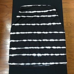 Black mini skirt with white stripes.